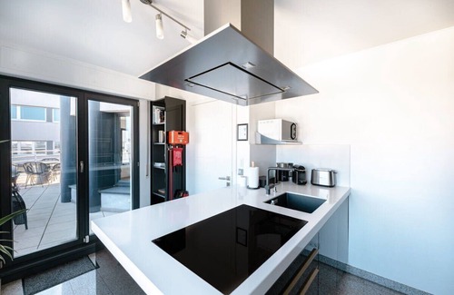 Gare Apartment | Luxurious 2BR Penthouse: Gym, Parking & Views