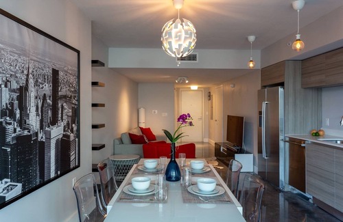 North Beach Condo | Luxurious 2BR, Pool, Hot tub, Sauna, Gym, Parking, Min to Beach