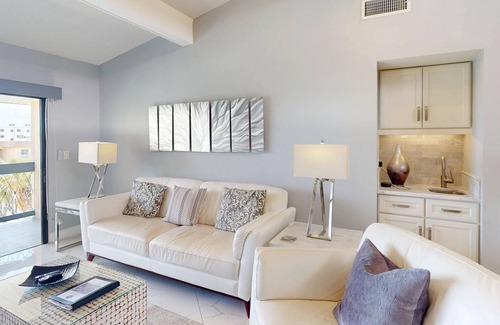 Capri Isle Condo | Luxurious Coastal Condo with Waterway Views, Pool, Balcony, and Steps to Treasure Island Beach.