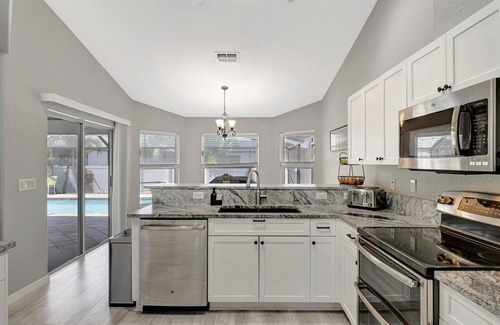 Pelican House | Luxurious Heated Saltwater Pool Home