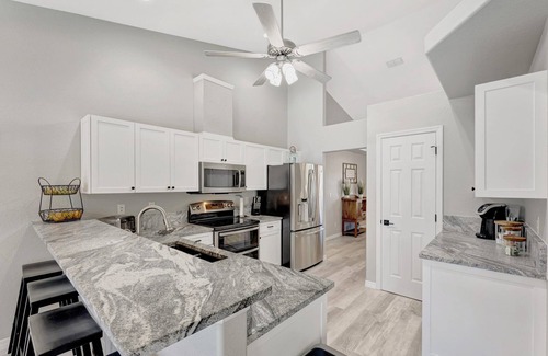 Pelican House | Luxurious Heated Saltwater Pool Home