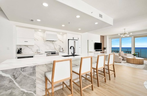 Thomas Drive Condo | Luxurious renovated Gulf-front condo with complimentary Beach Chair Service!