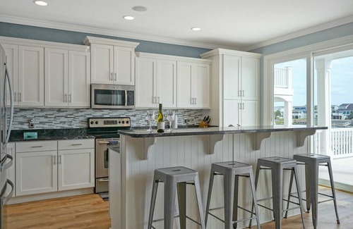 Sunset Beach House | Luxurious Sunset Beach Home On The Water With Pool, Boat Dock and Golf Cart
