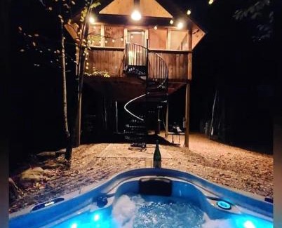 Springvale House | Luxurious Tree House with Hot Tub and Firepit, Perched over Littlefield Pond, Perfect for a Relaxing Weekend Getaway near Portland, Maine