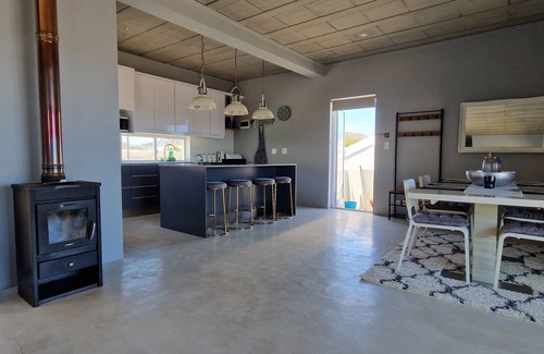 Sandbaai House | Luxury 2 Bed apartment boasting a rooftop terrace, with mountain & sea views.