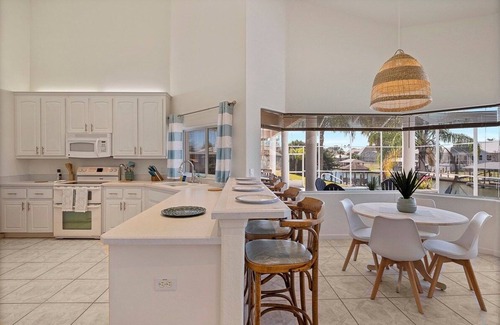 Palm Harbor House | Luxury 4-Bedroom Canal Home with Pool
