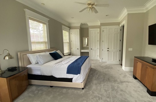 Waverly Resort | Luxury 7 bedroom mansion with horses, pool, hot tub, pond, swings and fire pit!