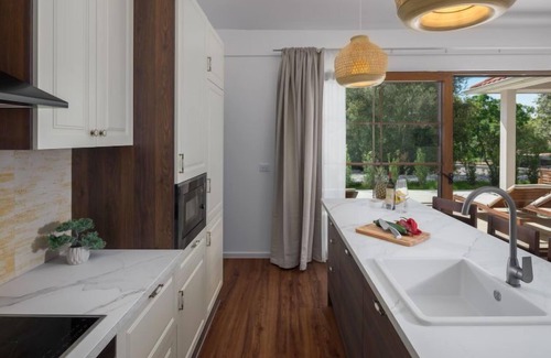 Bale House | Luxury Bay Villa with private hot tub by Interhome
