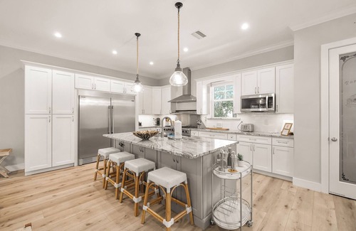 Vilano Beach House | Luxury beach escape, 2 blocks to the ocean & 1 block to the river! Enjoy a heated pool, hot tub, paddle boards, kayaks, golf cart & more—only 10 mins to downtown St. Augustine. Very clean, well stocked & perfect for couples, families & small groups.