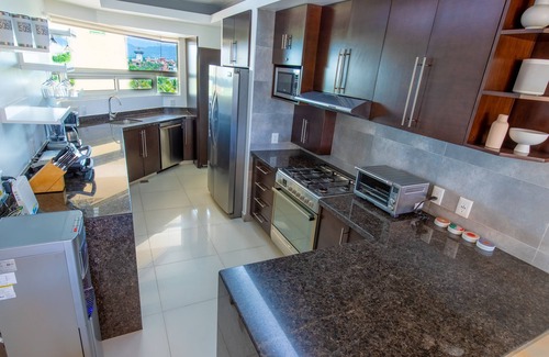 Marina Vallarta Condo | Luxury beachfront condo in Porto Fino, bonus studio, private beach, pool.
