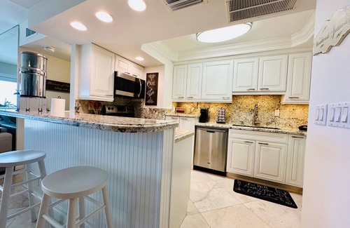 Moorings Condo | Luxury Beachfront, freshly painted and newly furnished walk to Venetian Village