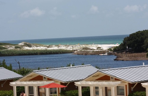 Santa Rosa Beach Condo | Luxury Condo overlooking pools, Redfish Lake, and the sparkling Gulf of Mexico
