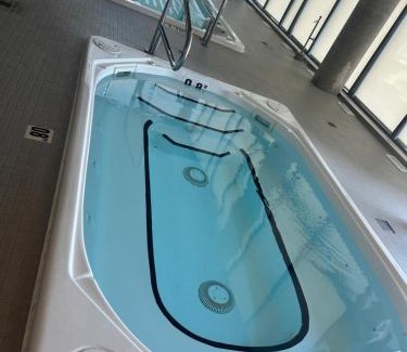 Kitchener Apartment | Luxury Condo with Hottub, outdoor firepit & Bowlin