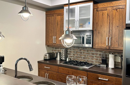 Big White Ski Resort Condo | Luxury family friendly condo with private hot tub and ski in/out to green run