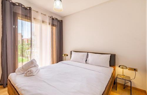 Menara Apartment | Luxury Garden-Level Apartment with Poolside Serenity
