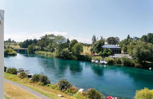 Taupo Apartment | Luxury Riverfront Apartment With Views and Pool Access