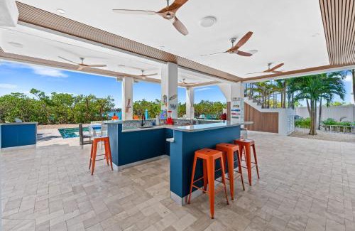 Marathon House | Luxury Seaside Escape ~ Heated Pool w Jacuzzi ~ Elevator ~ Dock ~ Scenic Views