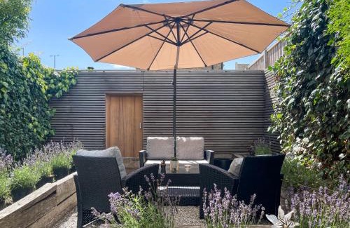 London Borough of Hounslow Apartment | Luxury Urban Oasis with Garden and Private Studio