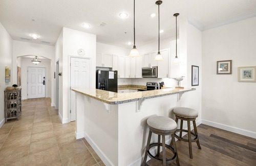 Palm Coast Condo | Luxury Waterfront Condo with Community Pool, Balcony + Lake Views