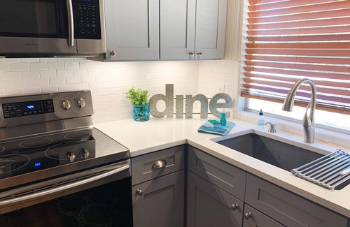 Kingsland House | Luxury WATERFRONT home with HEATED POOL AND SPA Sleeps 28+