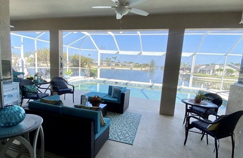 Caloosahatchee House | Luxury Waterfront Retreat-Heated Salt Pool Screened, Pedal Boat, Kayaks & Bikes
