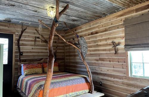 Dennis House | Magical Treehouse with Slide by Brazos River for Family Glamping Adventures in Texas