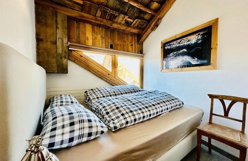 Sent Apartment | Maisonettewohnung im Alpenstil mit 360 Grad Kamin