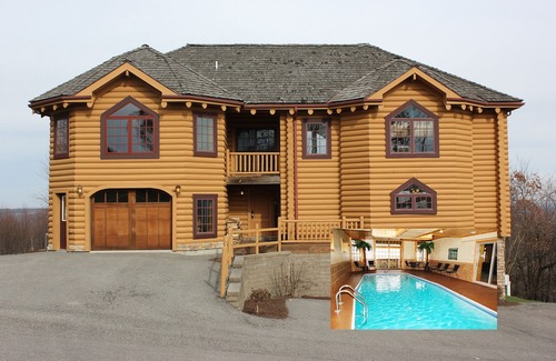 McHenry House | Majestic 8 BR Log Chateau-Ski Access-Indoor Pool/Sauna/Hot Tub-Theater-Boat Slip