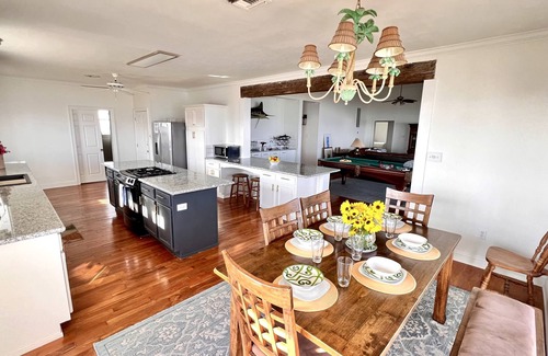 Grand Isle House | Majestic bayfront home. 450’ pier w/boat access, crabbing, fishing, & swimming.
