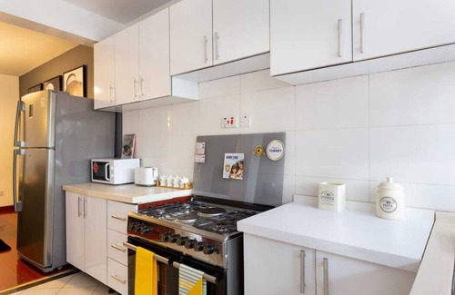 Kilimani Apartment | Marilyn Monroe themed 2bed, for comfort, relaxing decor, lounge area to work.