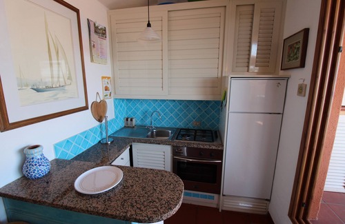 Golfo di Marinella Apartment | Marineled apartment 50 meters from the beach, swimming pool, restaurant bar, wifi