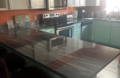 Northwest Point Apartment | Massive 3 bed 3.5 bath sea/pool view condo set amid lush tropical gardens