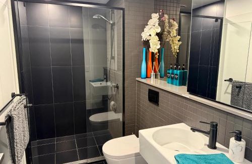 Braddon Apartment | Midnight Luxe 1BR 1Bath Apartment 104 in the heart of Braddon Pool Sauna Secure Parking Wine WiFi