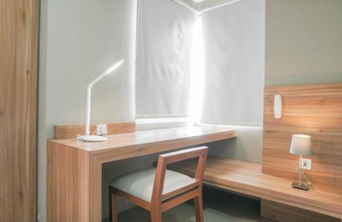 Cikarang Apartment | Minimalist and Cozy Stay 1BR Apartment at Mustika Golf Residence By Travelio