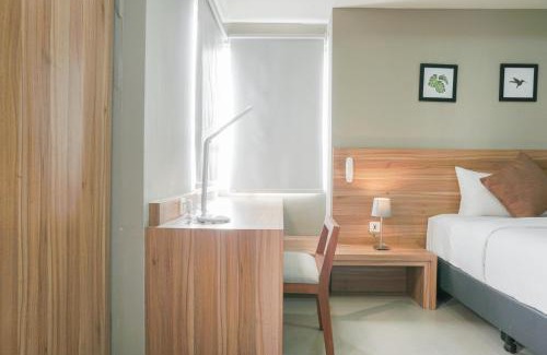 Cikarang Apartment | Minimalist and Cozy Stay 1BR Apartment at Mustika Golf Residence By Travelio