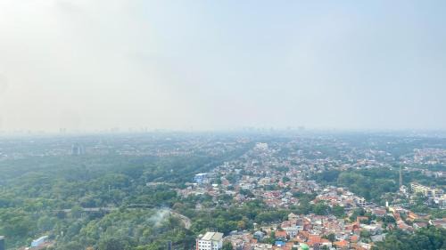 Pondokcina Apartment | Minimalist and Homey Studio at Evenciio Margonda Apartment By Travelio