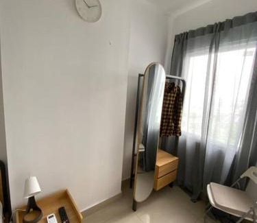 Tangerang Apartment | Minimalist room at The Nest Apartment by Popobella Near Puri Indah West Jakarta