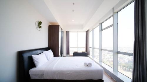 Surabaya Apartment | Minimalist with Beautiful View 2BR at Grand Sungkono Lagoon Apartment By Travelio