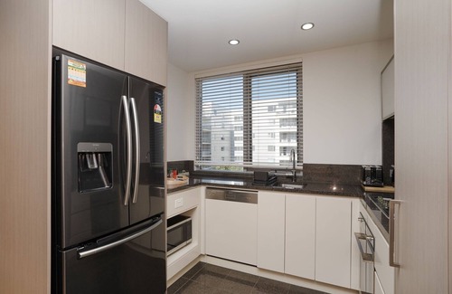 Reid Apartment | Modern 1-Bed Unit with Pool Views and Balcony