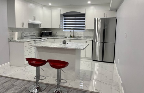 Woodslee House | Modern 1BR Basement Retreat