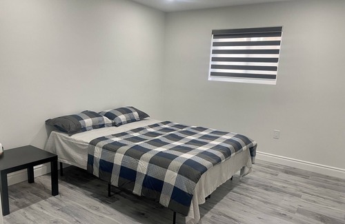 Woodslee House | Modern 1BR Basement Retreat