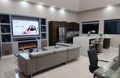 Eden Gardens Apartment | Modern 2BRPenthouse with Swimming Pool near Devon House! Central Location.