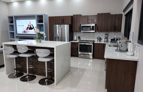 Eden Gardens Apartment | Modern 2BRPenthouse with Swimming Pool near Devon House! Central Location.