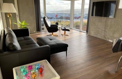 Hoyvik Apartment | Modern Apartment With City & Oceanside View