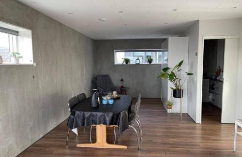 Hoyvik Apartment | Modern Apartment With City & Oceanside View