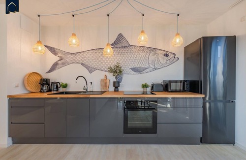 Koelpinsee Apartment | Modern bluefish hut with balcony - only 800 m to the beach