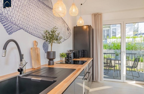 Koelpinsee Apartment | Modern bluefish hut with balcony - only 800 m to the beach