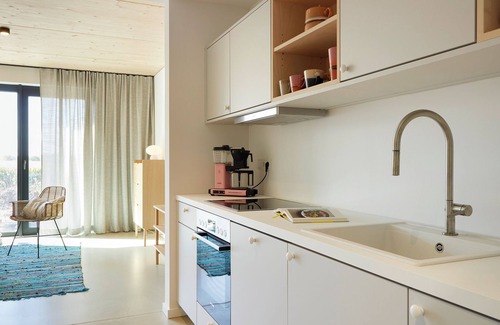 Hohwacht Apartment | Modern duplex apartment with rooftop terrace.