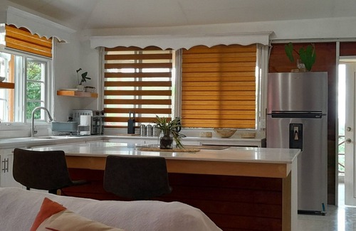 Saint Sylvans Cabin | Modern Eco lodge with A/C in bedrooms and 40ft patio for relaxation and fun.