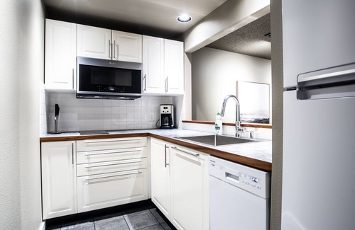 Glacier Condo | Modern & Fresh Mountain Condo - Clubhouse w/Indoor Pool, Spa, Sauna, Gym, Game Room & Sports Courts